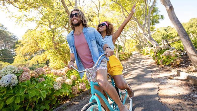 A couple riding a bike